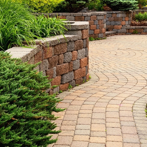 Image of block retaining wall and brick pavers